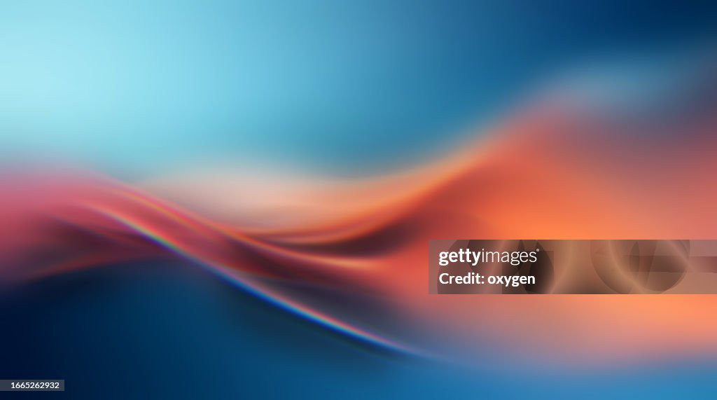 Abstract Motion Blured Orange Soft Wave Prism on Blue Background Background