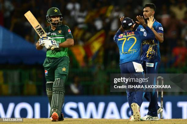 Sri Lanka's Matheesha Pathirana celebrates with teammate after taking the wicket of Pakistan's Abdullah Shafique during the Asia Cup 2023 Super Four...