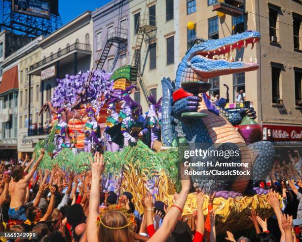 1980s Alligator on front of a mardi gras rex parade float new orleans louisiana.