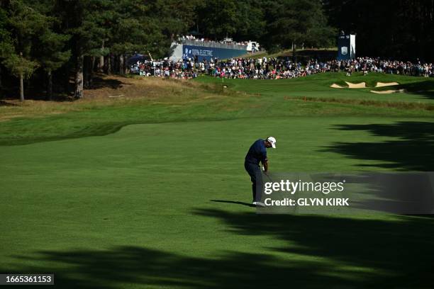 Ireland's Padraig Harrington plays a shot from the 13th fairway on day one of the BMW PGA Championship at Wentworth Golf Club, south-west of London,...