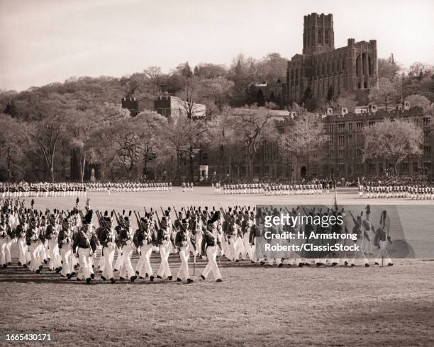 1960s West point cadets in full dress uniform pass in review parade on the plain of the United States military academy NY USA.