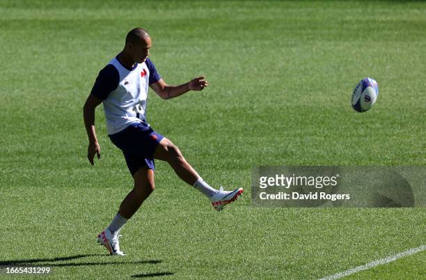 Gael Fickou kicks the ball upfield during the France captain's run ahead of their Rugby World Cup France 2023 match against New Zealand at Stade de...