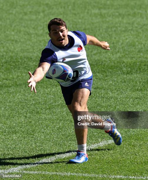 Antoine Dupont catches the ball during the France captain's run ahead of their Rugby World Cup France 2023 match against New Zealand at Stade de...