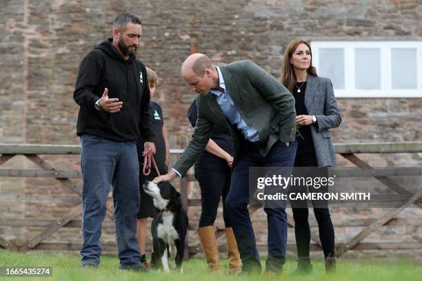 Britain's Prince William, Prince of Wales and Britain's Catherine, Princess of Wales talk with We Are Farming Minds charity founders Sam and Emily...