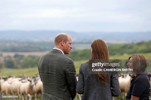 Britain's Prince William, Prince of Wales and Britain's Catherine, Princess of Wales talk with We Are Farming Minds charity co-founder Emily Stables,...