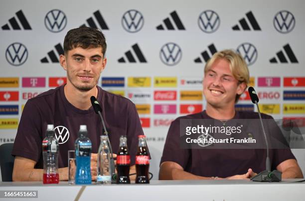 Kai Havertz and Julian Brandt of Germany talk with the media during a press conference on September 07, 2023 in Wolfsburg, Germany.