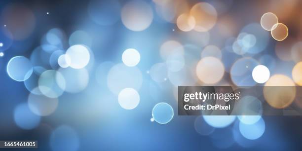 defocused lights on blue background - bokeh lights stock pictures, royalty-free photos & images