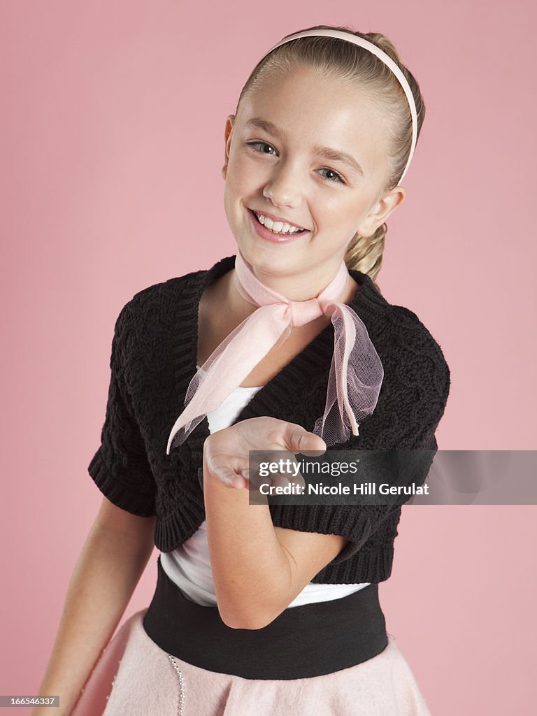 Portrait of girl (10-11) in 1950s style costume for Halloween