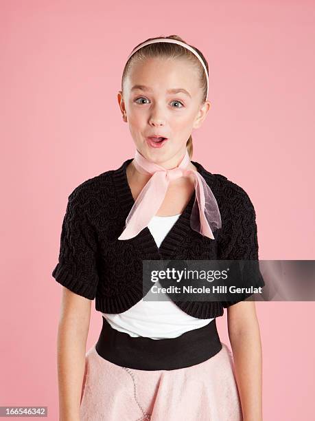 portrait of girl (10-11) in 1950s style costume for halloween - poodle skirt fotografías e imágenes de stock