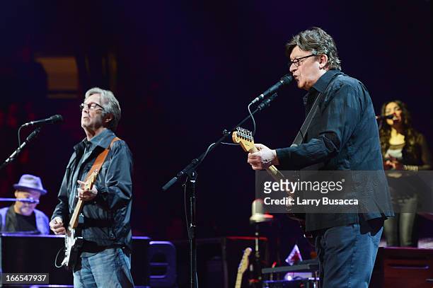 Eric Clapton and Robbie Robertson perform on stage during the 2013 Crossroads Guitar Festival at Madison Square Garden on April 13, 2013 in New York...