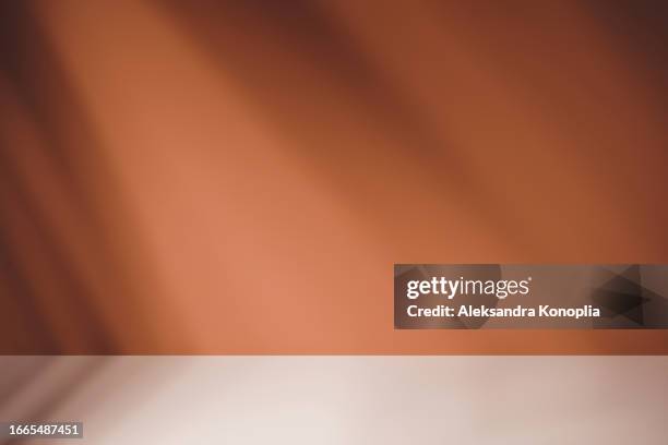 empty brown beige studio room background with abstract diagonal window light and shadows. minimal 3d duo tone architectural stage with soft light effect. front view, copy space - toile de fond photos et images de collection