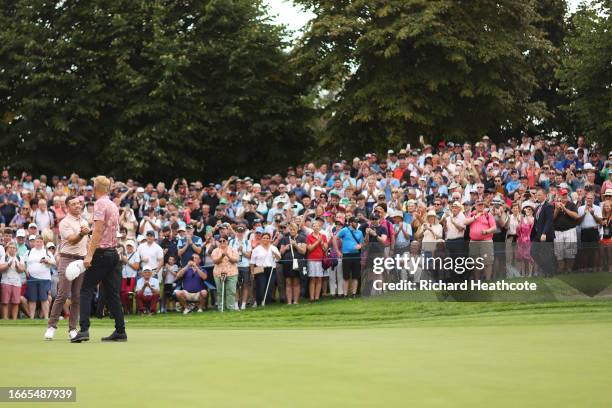 Rory McIlroy of Northern Ireland and Adrian Meronk of Poland shake hands on the ninth green during Day One of the Horizon Irish Open at The K Club on...