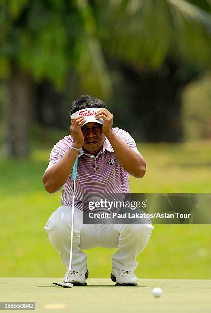 Elmer Salvador of the Phlippines in action during day four of the Solaire Open at Wack Wack Golf and Country Club on April 14, 2013 in Manila,...