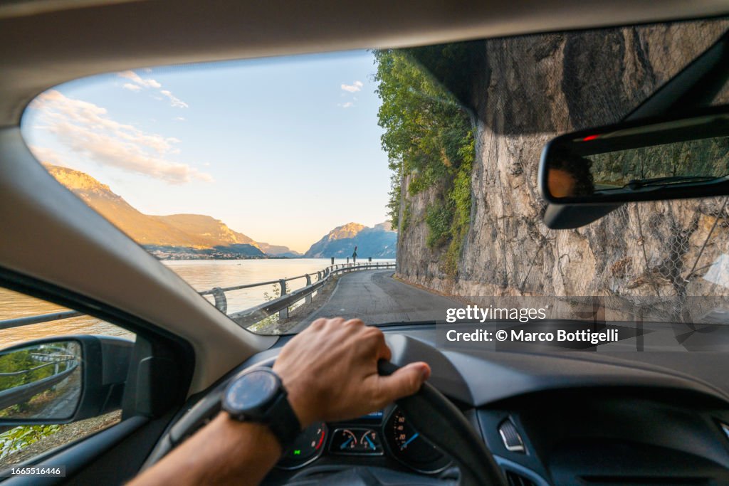 Personal perspective of person driving along lake Como, Italy