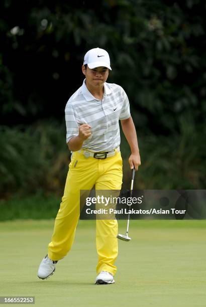Miguel Tabuena of the Philippines celebrates a putt during day four of the Solaire Open at Wack Wack Golf and Country Club on April 14, 2013 in...