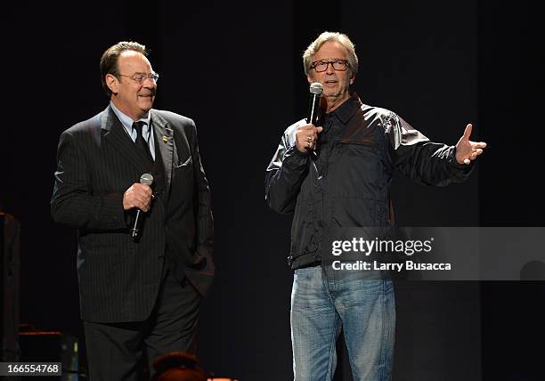 Hosts Dan Aykroyd and Eric Clapton speak on stage during the 2013 Crossroads Guitar Festival at Madison Square Garden on April 13, 2013 in New York...