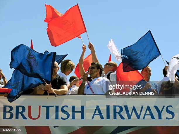 Demonstrators prepare to set off on a double decker bus as they take part in a protest for British Airways cabin crew during the first day of a...