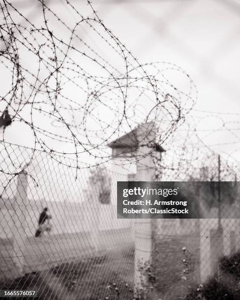 1970s Shot of barbed wire fence at concentration camp dachau bavaria south germany.