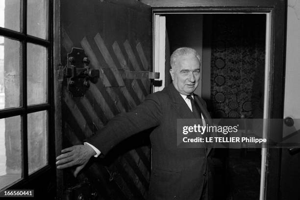 Close-Up Of Louis Joxe. Paris - 23 février 1962 - Portrait de Louis JOXE, ministre des Affaires algériennes, ouvrant la porte d'entrée blindée de son...