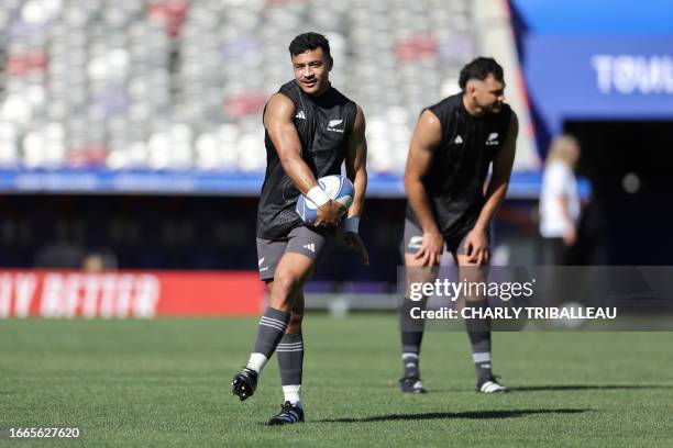 New Zealand's fly-half Richie Mo'unga gestures during the captain's run training session at the Stadium de Toulouse, in Toulouse, southwestern...