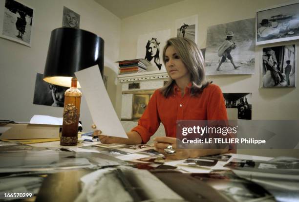 Agathe Gaillard As 'Marianne' And Jean Philippe Charbonnier. En novembre 1968, Agathe GAILLARD, dans un bureau, décoré de photos aux murs, attablée...