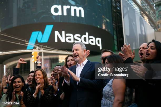 Rene Haas, chief executive officer of Arm Ltd., center, during the company's IPO at the Nasdaq MarketSite in New York, US, on Thursday, Sept. 14,...