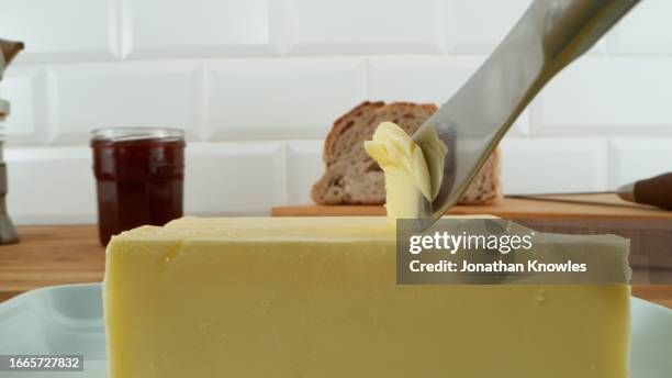 butter knife and butter - butter dish stock pictures, royalty-free photos & images