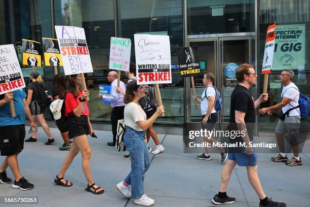Members of Writers Guild of America East and SAG-AFTRA walk a picket line outside of the HBO and Amazon NYC headquarters on September 07, 2023 in New...
