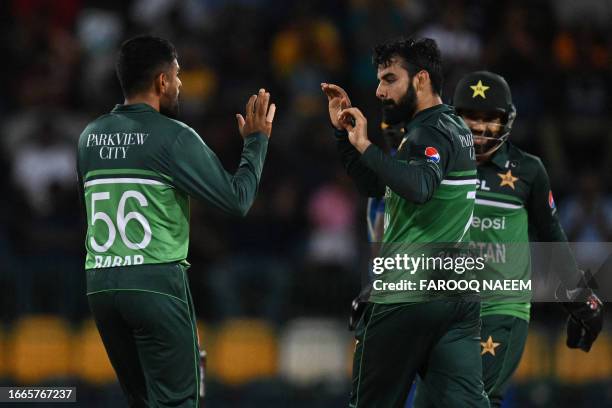 Pakistan's Shadab Khan celebrates with Babar Azam after taking wicket of Sri Lanka's Pathum Nissanka during the Asia Cup 2023 Super Four one-day...