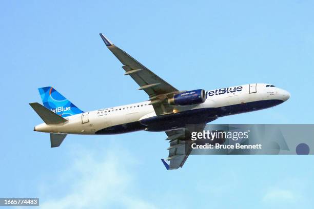 JetBlue airlines jet flies over Nickerson Beach Park on September 04, 2023 in Lido Beach, New York.