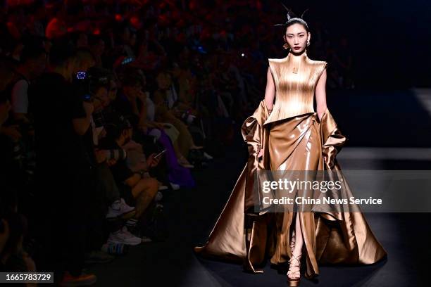 Model walks the runway at MISUITY collection show by designer GAOTIAN during the China Fashion Week S/S 2024 at Beijing Hotel on September 7, 2023 in...