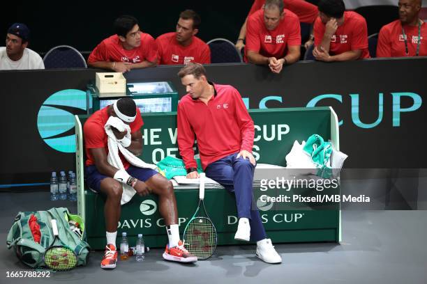 Frances Tiafoe of United States speaks to Team Captain of United States Bob Bryan during the 2023 Davis Cup Finals Group D Stage match between...