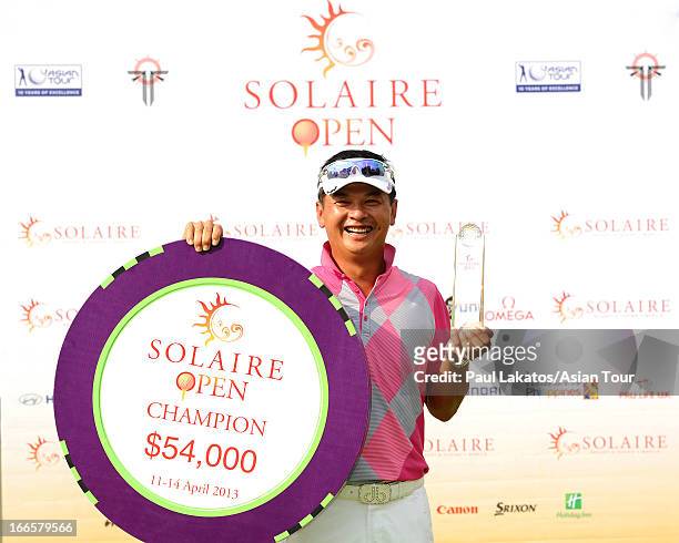 Lin Wen-tang of Chinese Taipei poses with the winner's trophy during day four of the Solaire Open at Wack Wack Golf and Country Club on April 14,...