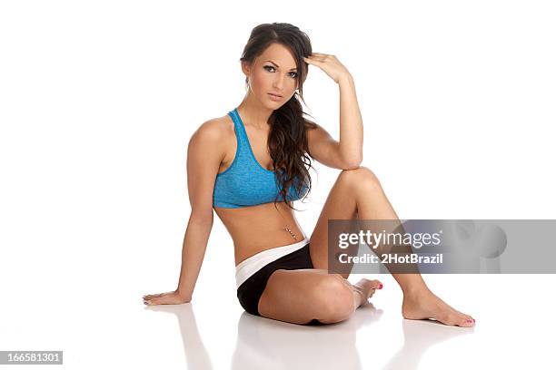young fitness woman sitting on floor - isolated - 2hotbrazil bildbanksfoton och bilder