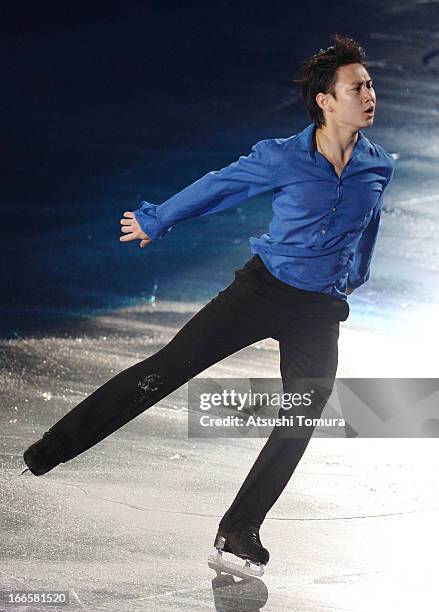 Denis Ten of Kazakhstan performs during day four of the ISU World Team Trophy at Yoyogi National Gymnasium on April 14, 2013 in Tokyo, Japan.