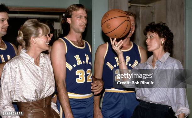 Actress Linda Evans and Actress Kate Jackson with Beverly Hills Police Officers before a charity basketball game against Hollywood Celebrities,...