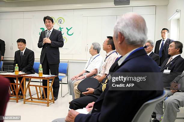 Japanese Prime Minister Shinzo Abe speaks during a town hall meeting with islanders on Chichijima, a part of Ogasawara Islands 000 kilometers south...