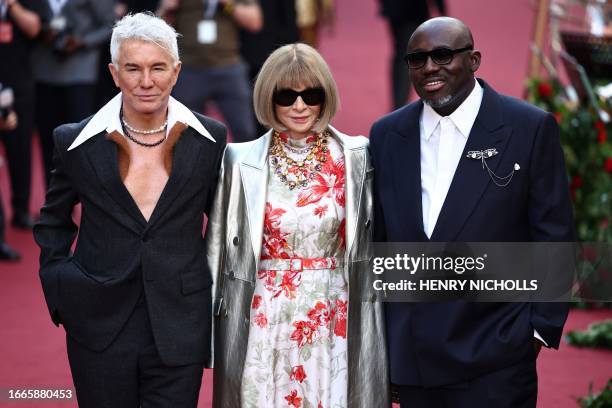 Australian film director Baz Luhrmann, Vogue editor-in-chief Anna Wintour and British Vogue editor-in-chief Edward Enninful pose upon arrival to...