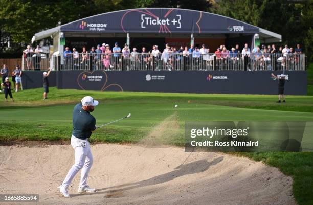 Tyrrell Hatton of England plays a bunker shot on the 16th hole during Day One of the Horizon Irish Open at The K Club on September 07, 2023 in...