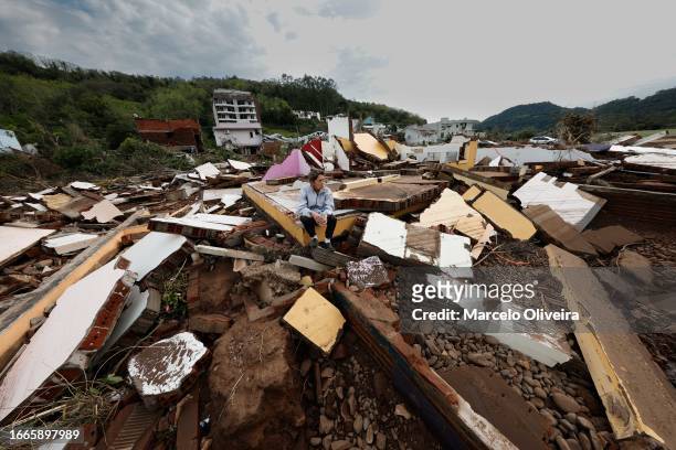 Nelsa Teresinha sits on the debris of her house which was destroyed by the flood on September 7, 2023 in Muçum, Brazil. An extratropical cyclone hits...
