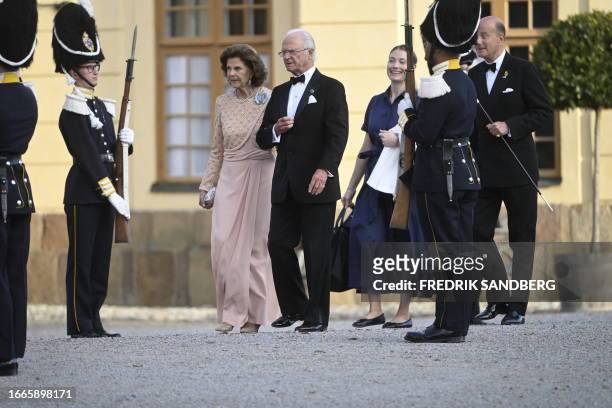 Sweden's Queen Silvia and King Carl XVI Gustaf arrive at Drottningholm Palace Theatre in Stockholm, September 14 for the Royal Opera's jubilee...