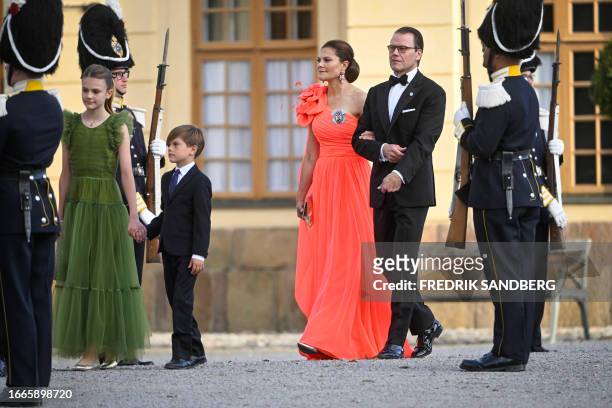 Sweden's Princess Estelle, Prince Oscar, Crown Princess Victoria and Prince Daniel arrive at Drottningholm Palace Theatre in Stockholm, September 14...
