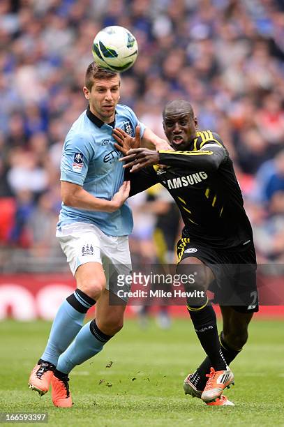 Matija Nastasic of Manchester City battles with Demba Ba of Chelsea during the FA Cup with Budweiser Semi Final match between Chelsea and Manchester...