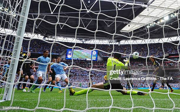 Samir Nasri of Manchester City scores the opening goal past Petr Cech of Chelsea during the FA Cup with Budweiser Semi Final match between Chelsea...