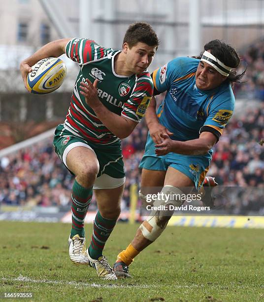 Ben Youngs of Leicester breaks clear of Jonathan Poff during the Aviva Premiership match between Leicester Tigers and London Wasps at Welford Road on...