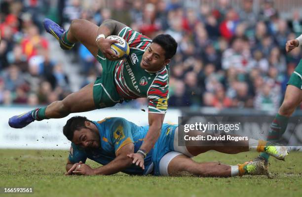 Manu Tuilagi of Leicester is brought down by Billy Vunipola during the Aviva Premiership match between Leicester Tigers and London Wasps at Welford...