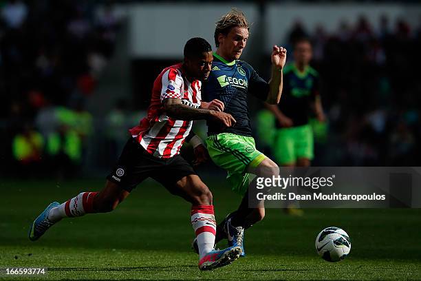 Jeremain Lens of PSV and Christian Poulsen of Ajax battle for the ball during the Eredivisie match between PSV Eindhoven and Ajax Amsterdam at...