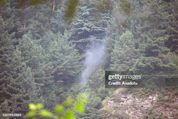 Smoke rises from the mountain after Indian army used ammunitions during the gun-battle between militants and security forces which entered second day...