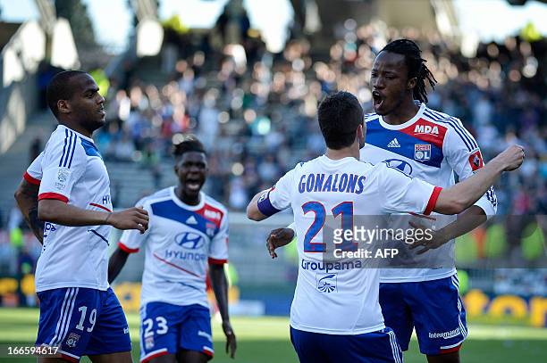 Lyon's Burkinabe defender Bakary Kone is congratulated by teammates after scoring a goal during the French L1 football match Olympique Lyonnais vs...