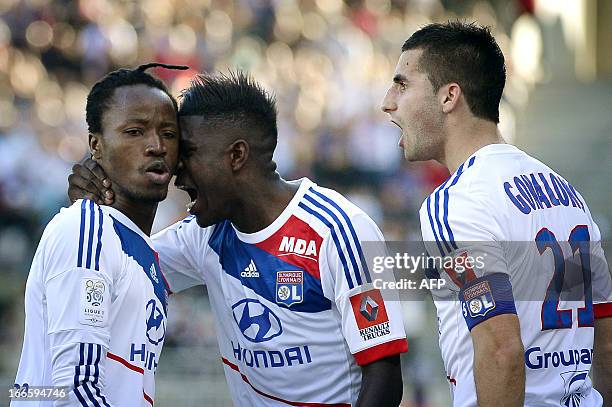 Lyon's Burkinabe defender Bakary Kone is congratulated by teammates after scoring a goal during the French L1 football match Olympique Lyonnais vs...